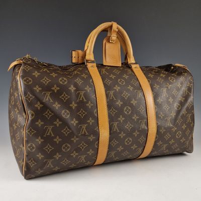 Sac Keepall Louis Vuitton en toile Monogram et cuir