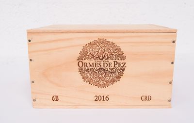 a close up of a wooden box with a label on it