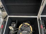 a case with a hose and other equipment inside of it