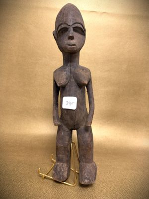 a statue of a person with a tag on it ' s chest