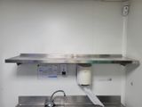 a sink with a paper towel on it in a kitchen