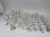 a lot of empty wine glasses on the table