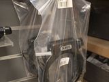 a plastic bag with a camera attached to it in a store