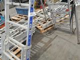 a ladder that is sitting on a pallet in a warehouse