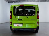 a green van that is parked inside of a building