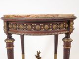 a small table with a marble top on a white background