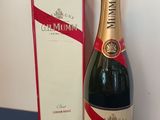 bottles of champagne and a box on a blue table