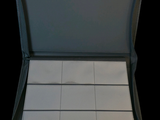 a black case with white squares in it on a black background