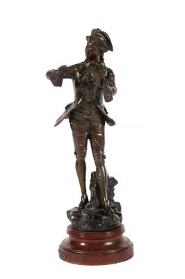 bronze statue of a man with a dog on a wooden base