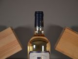 a bottle of wine that is sitting on a table