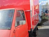 a red truck that is parked in a parking lot