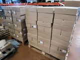 many boxes stacked on pallets in a warehouse