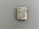 a small silver lighter sitting on top of a table