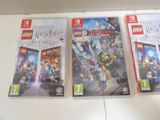 three nintendo wii games are sitting on a counter top