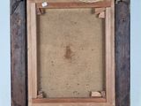 a close up of a picture frame with a rope around it