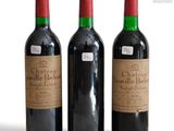 three bottles of wine sitting next to each other on a table