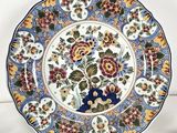 an image of a decorative plate with flowers on it