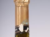 a bottle of wine that is sitting on a table