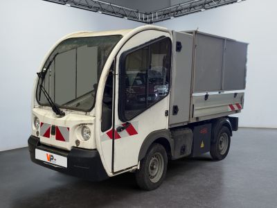 a white truck that is parked inside of a building
