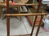 a wooden chair that is sitting in the middle of a room
