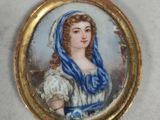 portrait of a woman with a blue scarf in a gold - plated frame