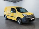 the yellow van is parked in a large room with white walls