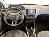 the interior of a small car with a steering wheel and dashboard