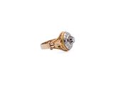 a close up of a gold ring with a diamond on it