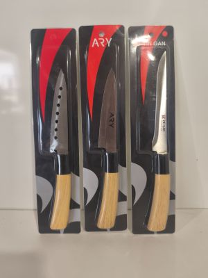 three knives are in the package on a white surface