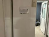 an image of a refrigerator in a kitchen with a door open