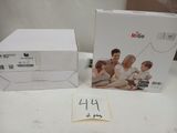 two boxes with a picture of a family sitting on a couch