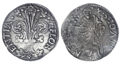 a silver coin with an image of a man on it