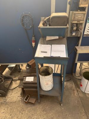 an image of a work station with a lot of work on it