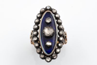 a close up of a ring on a white surface