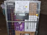 a metal cage with a bunch of items in it