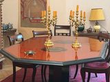 a dining room with a table and chairs in it