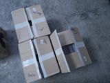 several cardboard boxes are stacked on top of each other on the floor