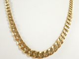 a close up of a gold necklace on a mannequin mannequin mannequin mannequin mannequin mannequin mannequin manne