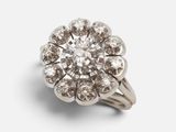 a close up of a diamond ring on a white background