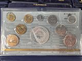 a lot of coins sitting in a case on a table