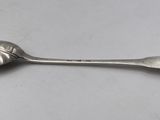 silver plated spoon with a spoon shaped like a leaf