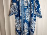 a blue and white dress with a floral pattern on it