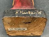 an image of a wooden block with writing on it on a table