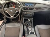 a dashboard of a car with a steering wheel and dashboard controls