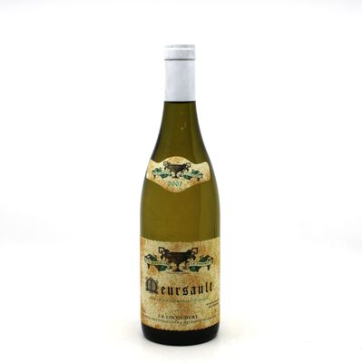 an image of a bottle of wine sitting on top of a white table