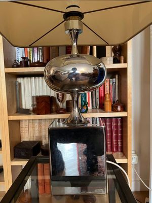 a lamp that is sitting on top of a glass table