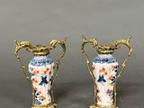 pair of antique chinese vases with handles and flowers on them