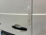 a white van that has a sticker on the door