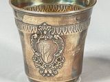 a silver cup that is sitting on a table