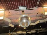 a disco ball hanging from the ceiling of a building